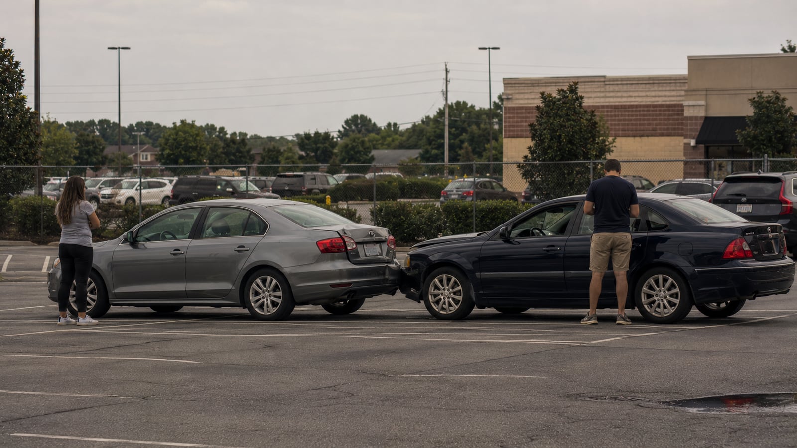 Two vehicles involved in a minor parking lot fender-bender at a north Mississippi suburban retail strip