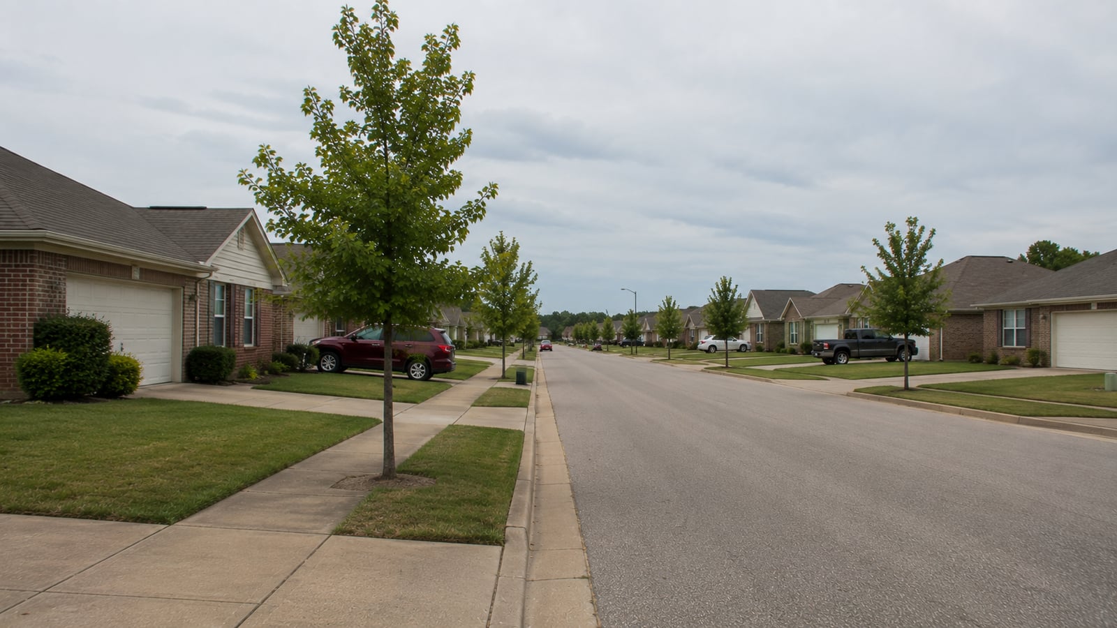 Quiet residential street in a Horn Lake Mississippi subdivision showing flat terrain and early-2000s single-family homes